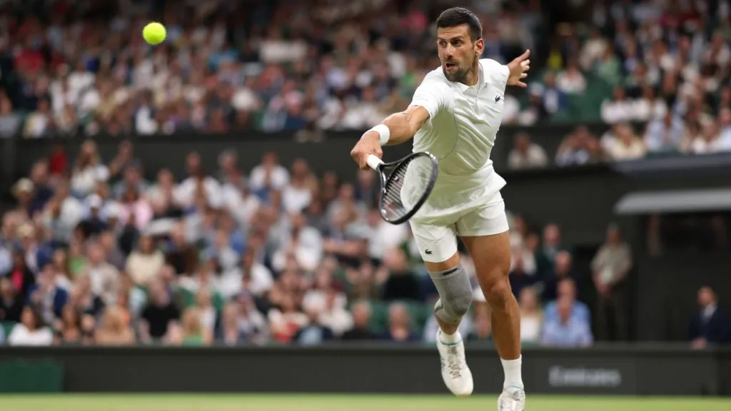 Novak Djokovic plays a backhand against Holger Rune in his Gentlemen’s Singles fourth round match during day eight of The Championships Wimbledon 2024. (Julian Finney/Getty Images)