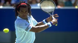 Yannick Noah in action during the 1990 Australian Open.