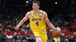 Dalton Knecht #4 of the Los Angeles Lakers controls the ball against the Washington Wizards during the second half at Capital One Arena.