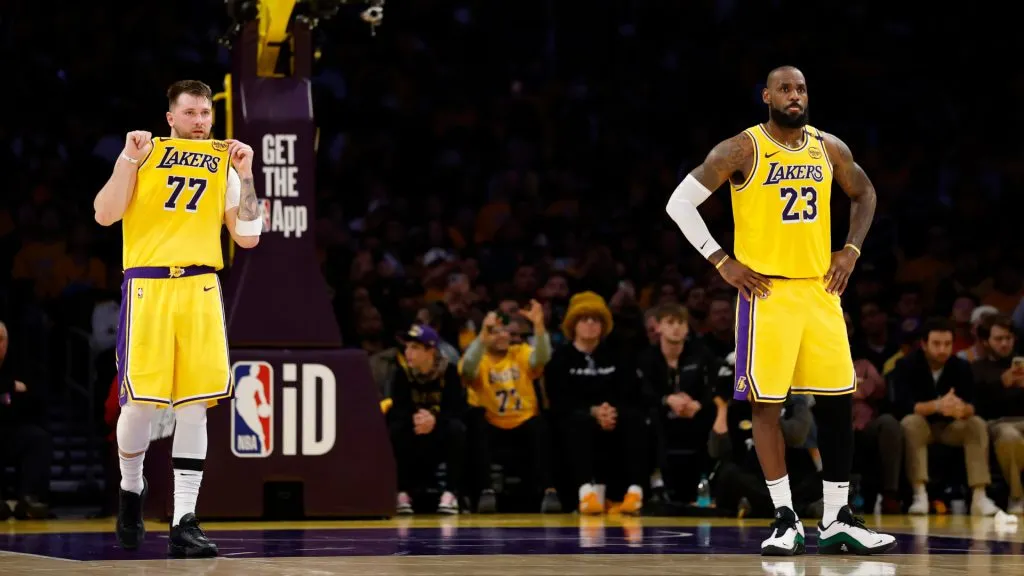 Luka Doncic #77 and LeBron James #23 of the Los Angeles Lakers look on during the second quarter of a game against the Utah Jazz. (Ronald Martinez/Getty Images)