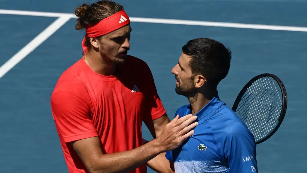 Novak Djokovic of Serbia is embraced by Alexander Zverev of Germany after retiring from the 2025 Australian Open. (Quinn Rooney/Getty Images)