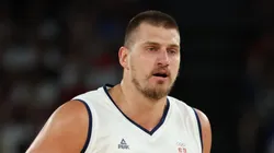 Nikola Jokic #15 of Team Serbia brings the ball up the court during the Men's Quarterfinal match between Australia and Serbia on day eleven of the Olympic Games