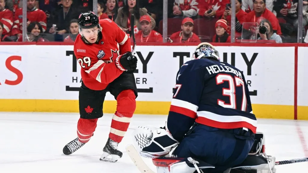 Nathan MacKinnon #29 of Team Canada is stopped by Connor Hellebuyck #37 of Team USA during the second period in the 4 Nations Face-Off game at the Bell Centre on February 15, 2025 in Montreal, Quebec, Canada.