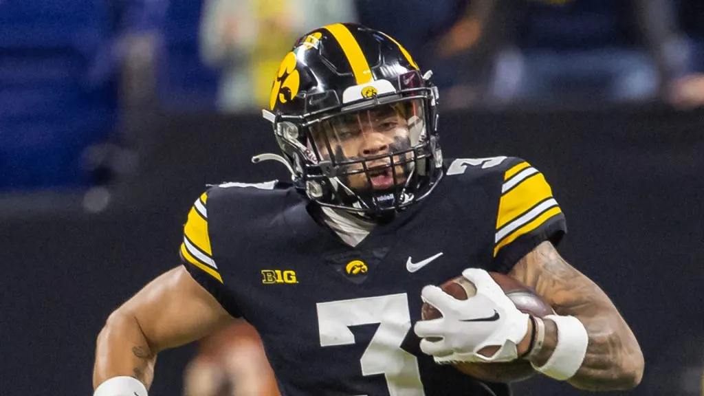 Cooper DeJean #3 of the Iowa Hawkeyes runs the ball during the first half against the Michigan Wolverines in the Big Ten Championship at Lucas Oil Stadium on December 2, 2023 in Indianapolis, Indiana.