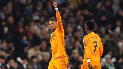 Kylian Mbappe of Real Madrid celebrates scoring his team's first goal during the UEFA Champions League 2024/25 League Knockout Play-off first leg match between Manchester City and Real Madrid C.F. at Manchester City Stadium on February 11, 2025 in Manchester, England.