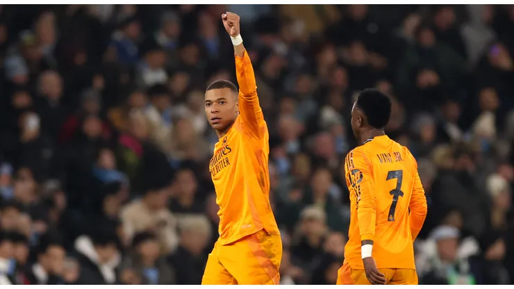 Kylian Mbappe of Real Madrid celebrates scoring his team's first goal during the UEFA Champions League 2024/25 League Knockout Play-off first leg match between Manchester City and Real Madrid C.F. at Manchester City Stadium on February 11, 2025 in Manchester, England.