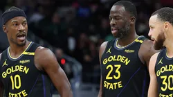 Jimmy Butler #10, Draymond Green #23 and Stephen Curry #30 of the Golden State Warriors.