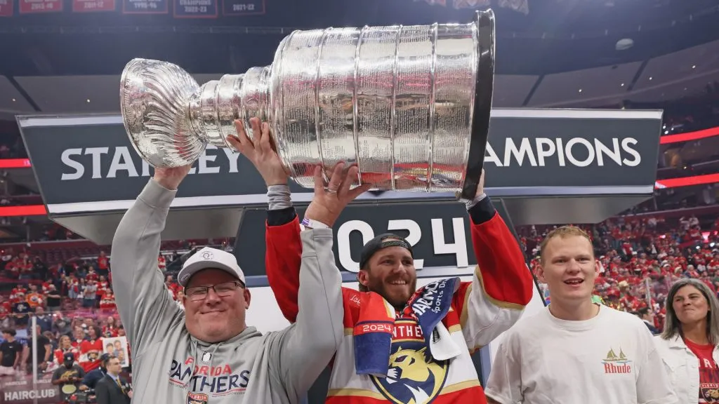 The Tkachuk family celebrates with the Stanley Cup following a 2-1 victory over the Edmonton Oilers in Game Seven of the 2024 NHL Stanley Cup Final at Amerant Bank Arena on June 24, 2024 in Sunrise, Florida.
