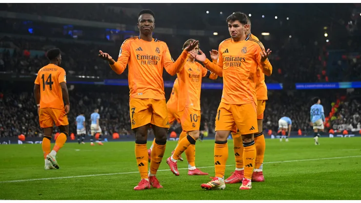 Brahim Diaz of Real Madrid celebrates scoring his team's second goal with Vinicius Junior during the UEFA Champions League 2024/25 League Knockout Play-off first leg match between Manchester City and Real Madrid C.F. at Manchester City Stadium on February 11, 2025 in Manchester, England.