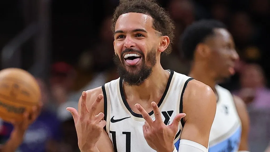 Trae Young #11 of the Atlanta Hawks reacts after a three-point basket by Garrison Mathews #24 against the Phoenix Suns during the fourth quarter on January 14, 2025. (Source: Kevin C. Cox/Getty Images)