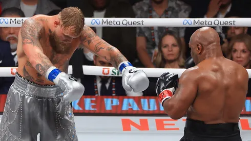 Jake Paul honors Mike Tyson after his unanimous-decision win during a heavyweight bout.