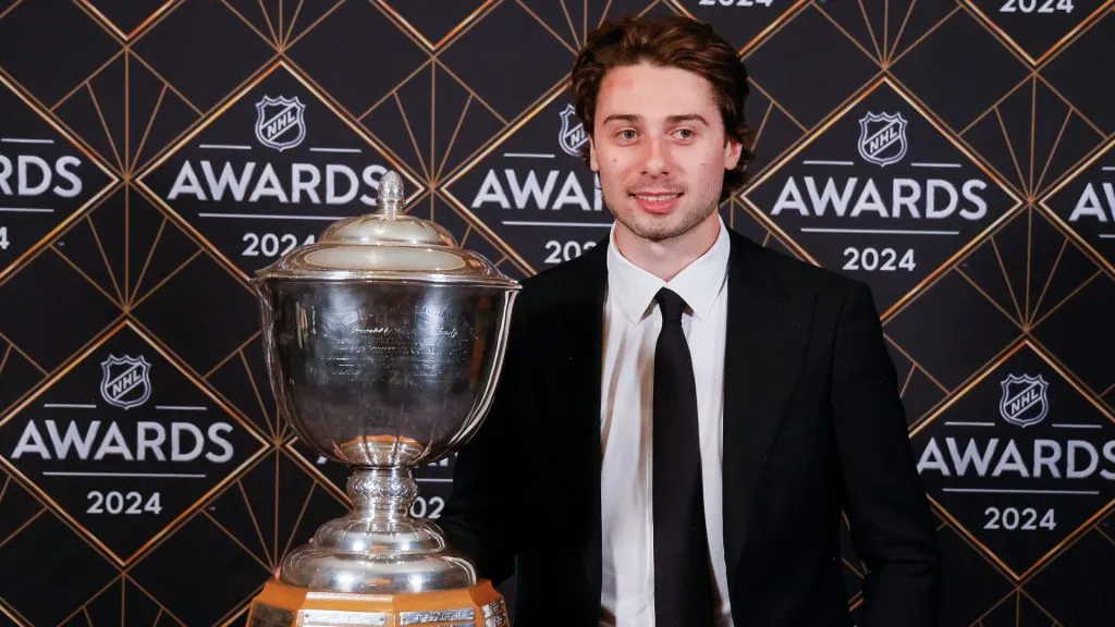 Quinn Hughes of the Vancouver Canucks poses with the James Norris Memorial Trophy during the 2024 NHL Awards at BleauLive Theater at Fontainebleau Las Vegas on June 27, 2024 in Las Vegas, Nevada.
