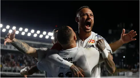 Guilherme of Santos celebrates with teammate Neymar