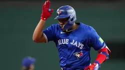 Vladimir Guerrero Jr. #27 of the Toronto Blue Jays celebrates toward his dugout after hitting a solo home run during the ninth inning against the Texas Rangers at Globe Life Field on September 19, 2024 in Arlington, Texas.