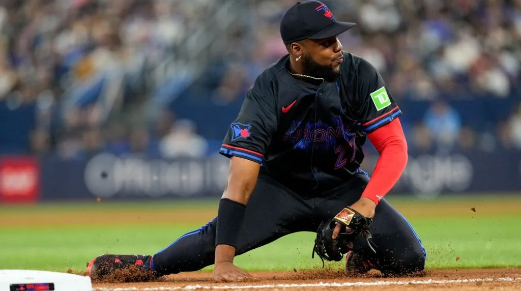 Vladimir Guerrero Jr. #27 of the Toronto Blue Jays makes a defensive play against the St. Louis Cardinals during the seventh inning at Rogers Centre on September 13, 2024 in Toronto, Canada. (Photo by Kevin Sousa/Getty Images)