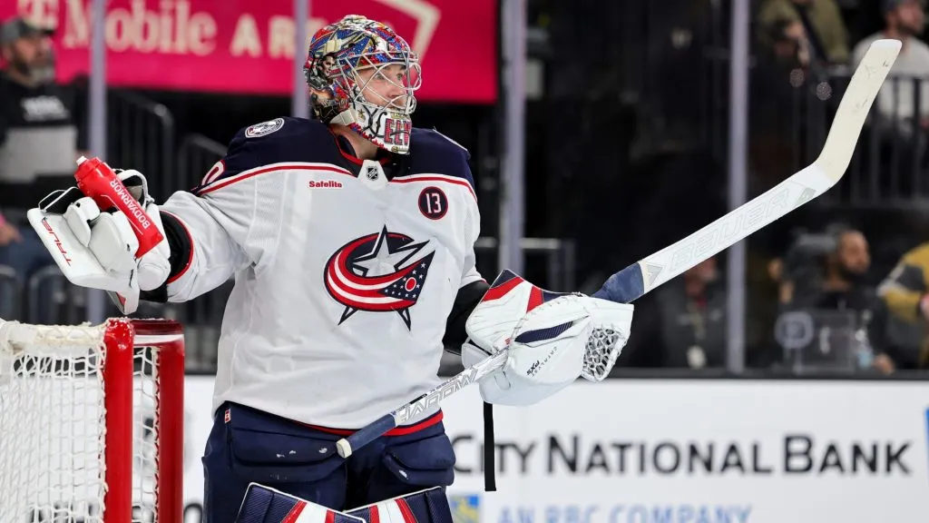 Elvis Merzlikins #90 of the Columbus Blue Jackets talks with a Vegas Golden Knights player in the second period of their game at T-Mobile Arena on January 30, 2025. (Source: Ethan Miller/Getty Images)