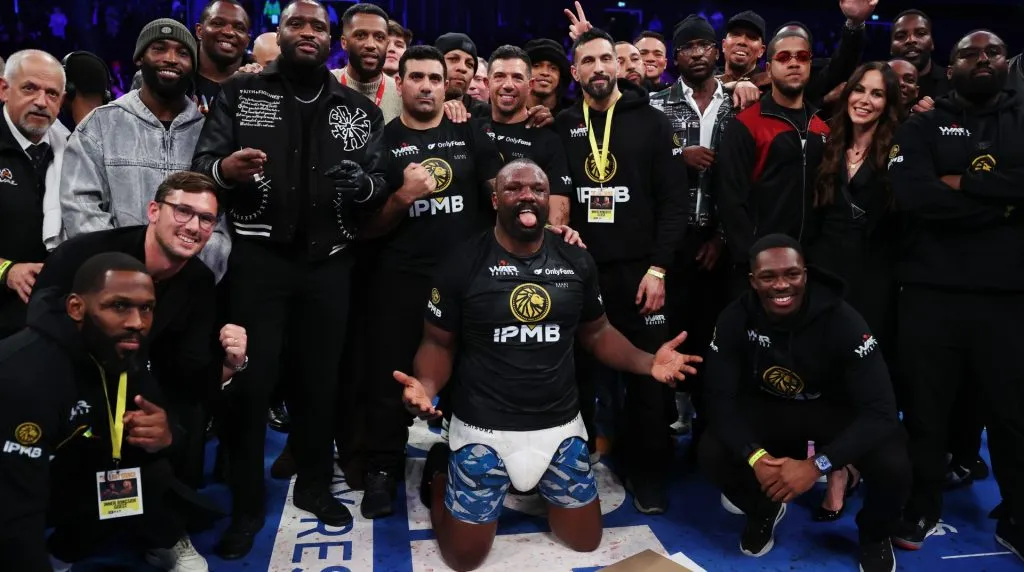 Derek Chisora poses for a photo with his team and guests as he celebrates victory following the Heavyweight fight between Derek Chisora and Otto Wallin as part of Derek Chisora v Otto Wallin, The Last Dance card at Co-op Live on February 08, 2025 in Manchester, England. (Photo by Alex Livesey/Getty Images)