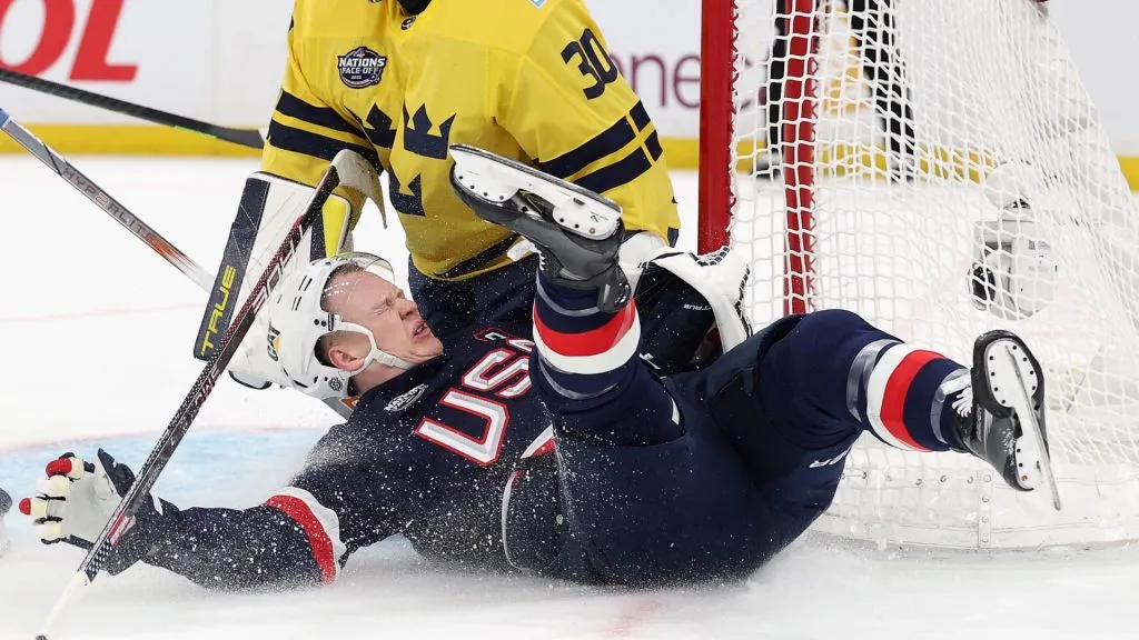 Erik Karlsson #65 of Team Sweden trips up Brady Tkachuk #7 of Team USA during the first period in the 4 Nations Face-Off game at TD Garden on February 17, 2025 in Boston, Massachusetts. Tkachuk was injured on the play.