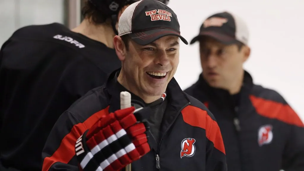 Adam Oates of the New Jersey Devils watches from the bench during the media day skate at the AmeriHealth Pavilion the day prior to Game One of the Stanley Cup Final in 2012. (Source: Bruce Bennett/Getty Images)