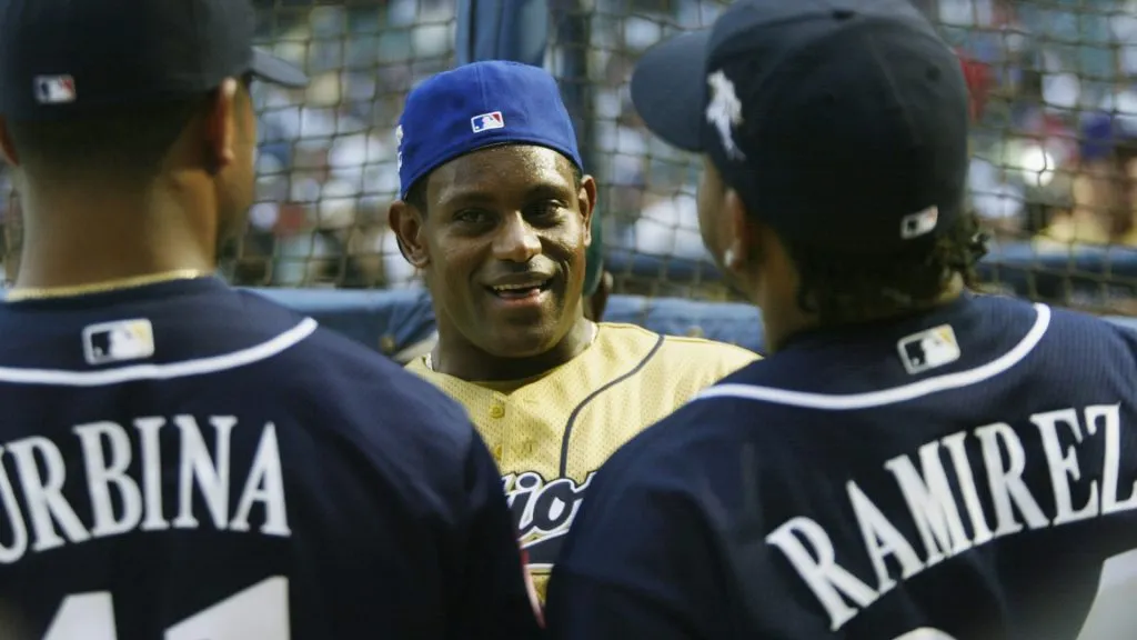 Rightfielder Sammy Sosa #22 of the Chicago Cubs chats with Ugueth Urbina and Manny Ramirez during batting practice for the MLB All-Star Game Game Home Run Derby in 2002. (Source: Andy Lyons/Getty Images)