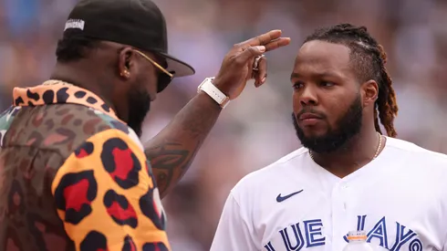 Vladimir Guerrero Jr. #27 of the Toronto Blue Jays speaks with David Ortiz during the T-Mobile Home Run Derby at T-Mobile Park on July 10, 2023 in Seattle, Washington.