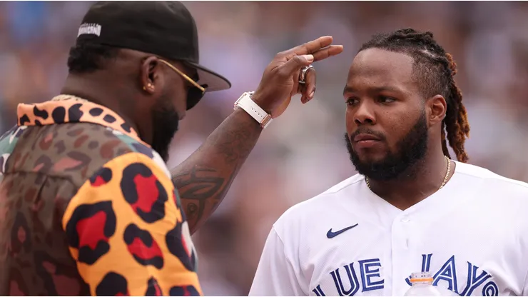 Vladimir Guerrero Jr. #27 of the Toronto Blue Jays speaks with David Ortiz during the T-Mobile Home Run Derby at T-Mobile Park on July 10, 2023 in Seattle, Washington.