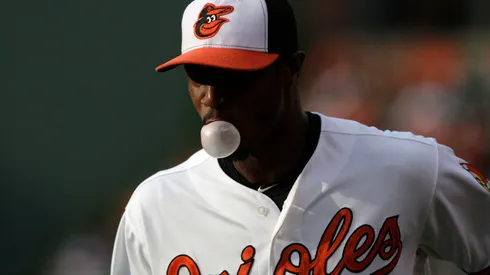 Centerfielder Adam Jones #10 of the Baltimore Orioles blows a bubble with his gum as he warms up before the start of a game against the Cleveland Indians in 2013.