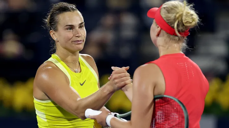 Aryna Sabalenka shakes hands after being defeated by Clara Tauson of Denmark in their third round match during day four of the Dubai Duty Free Tennis Championships in 2025.