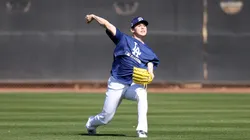 Roki Sasaki #11 of the Los Angeles Dodgers throw during workouts at Camelback Ranch on February 11, 2025 in Glendale, Arizona.