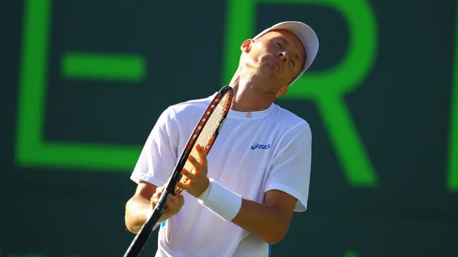 Nikolay Davydenko reacts during a match against John Isner in 2012 ( Al Bello/Getty Images)