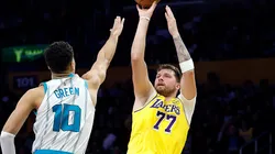 Luka Doncic #77 of the Los Angeles Lakers takes a shot against Josh Green #10 of the Charlotte Hornets