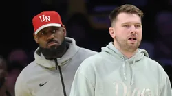 Luka Doncic #77 and LeBron James #23 of the Los Angeles Lakers look on during the fourth quarter of a game against the Indiana Pacers