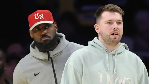 Luka Doncic #77 and LeBron James #23 of the Los Angeles Lakers look on during the fourth quarter of a game against the Indiana Pacers