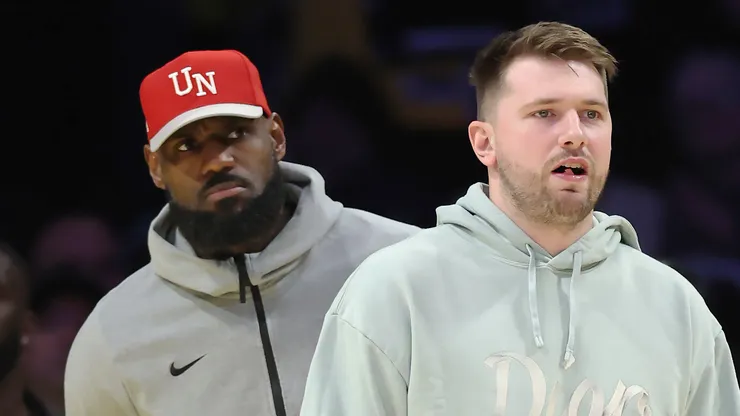 Luka Doncic #77 and LeBron James #23 of the Los Angeles Lakers look on during the fourth quarter of a game against the Indiana Pacers