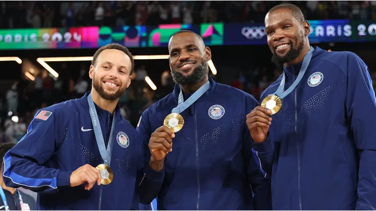 Stephen Curry, LeBron James, and Kevin Durant of Team United States pose for a photo during the Men's basketball medal ceremony on day fifteen of the Olympic Games Paris 2024 at Bercy Arena on August 10, 2024 in Paris, France.
