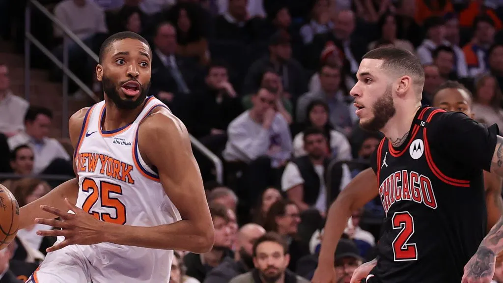Mikal Bridges #25 of the New York Knicks drives against Lonzo Ball #2 of the Chicago Bulls
