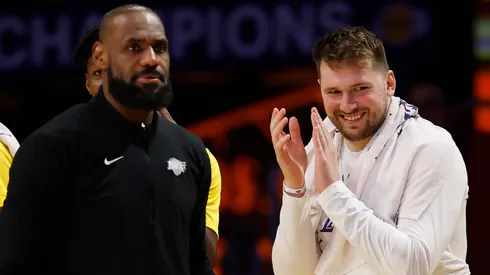 LeBron James #23 and Luka Doncic #77 of the Los Angeles Lakers react at the end of the fourth quarter of a game against the Utah Jazz at Crypto.com Arena.