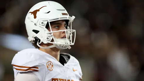Arch Manning #16 of the Texas Longhorns warms up before the game against the Texas A&M Aggies at Kyle Field on November 30, 2024 in College Station, Texas.