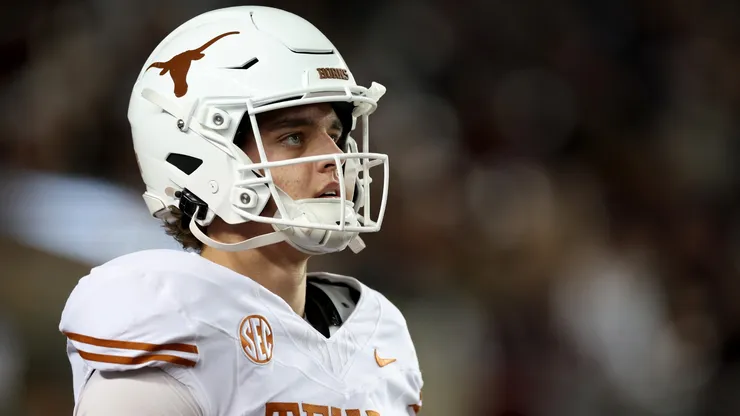 Arch Manning #16 of the Texas Longhorns warms up before the game against the Texas A&M Aggies at Kyle Field on November 30, 2024 in College Station, Texas.