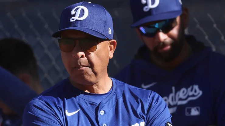 Manager Dave Roberts #50 of the Los Angeles Dodgers looks on during a team workout at Camelback Ranch on February 15, 2025 in Glendale, Arizona.