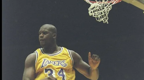 Los Angeles Lakers center Shaquille O"Neal lands after sinking the ball during a game against the Phoenix Suns