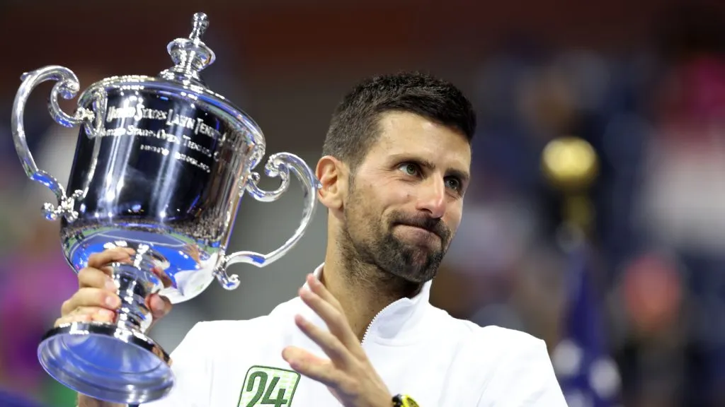 Novak Djokovic of Serbia holds aloft his winners trophy after defeating Daniil Medvedev of Russia during the 2023 US Open. (Clive Brunskill/Getty Images)