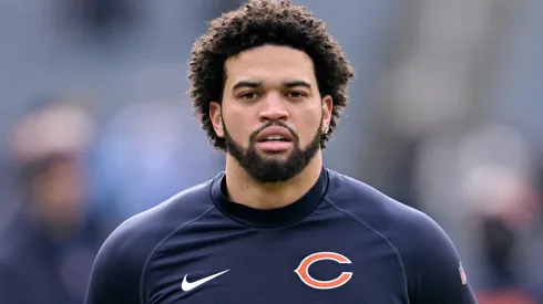 Caleb Williams #18 of the Chicago Bears looks on during warmups before the game against the Detroit Lions at Soldier Field on December 22, 2024 in Chicago, Illinois.