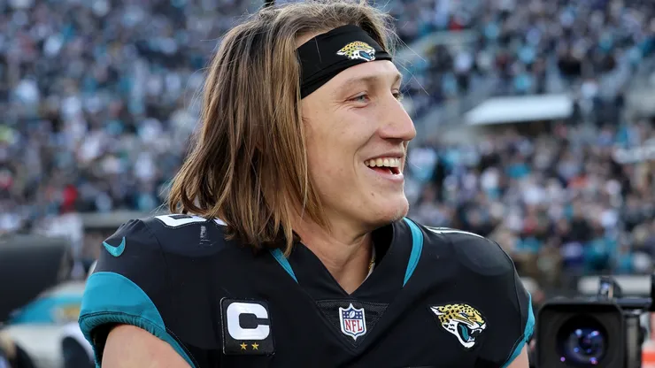 Trevor Lawrence #16 of the Jacksonville Jaguars smiles on the field after defeating the Dallas Cowboys at TIAA Bank Field on December 18, 2022 in Jacksonville, Florida.