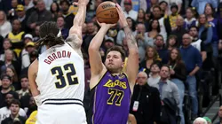 Luka Doncic #77 of the Los Angels Lakers puts up a shot against Aaron Gordon #32 of the Denver Nuggets