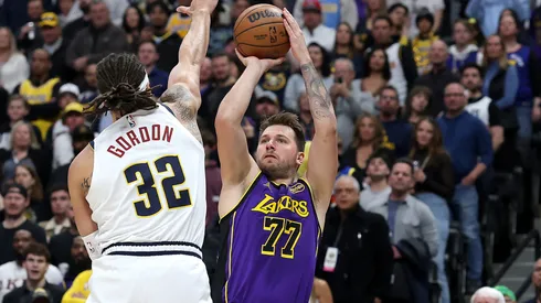 Luka Doncic #77 of the Los Angels Lakers puts up a shot against Aaron Gordon #32 of the Denver Nuggets