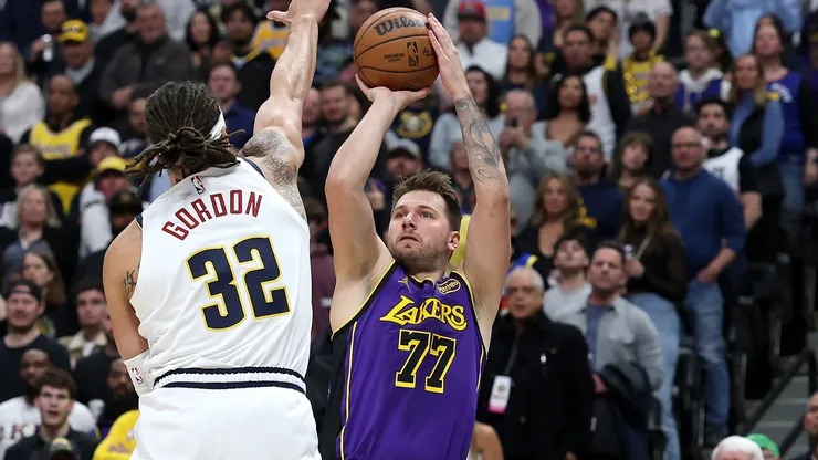 Luka Doncic #77 of the Los Angels Lakers puts up a shot against Aaron Gordon #32 of the Denver Nuggets