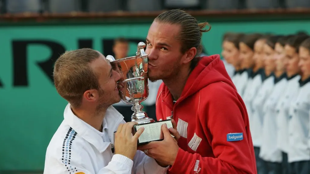 Rochus and Malisse celebrate the 2004 French Open doubles title (Clive Brunskill/Getty Images)