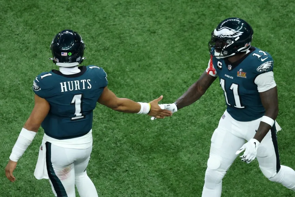 Jalen Hurts #1 of the Philadelphia Eagles celebrates with A.J. Brown #11