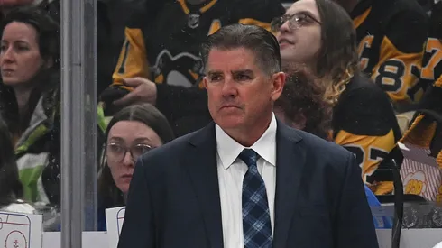 Peter Laviolette of the New York Rangers looks on in the second period during the game against the Pittsburgh Penguins at PPG PAINTS Arena on February 23, 2025 in Pittsburgh, Pennsylvania.